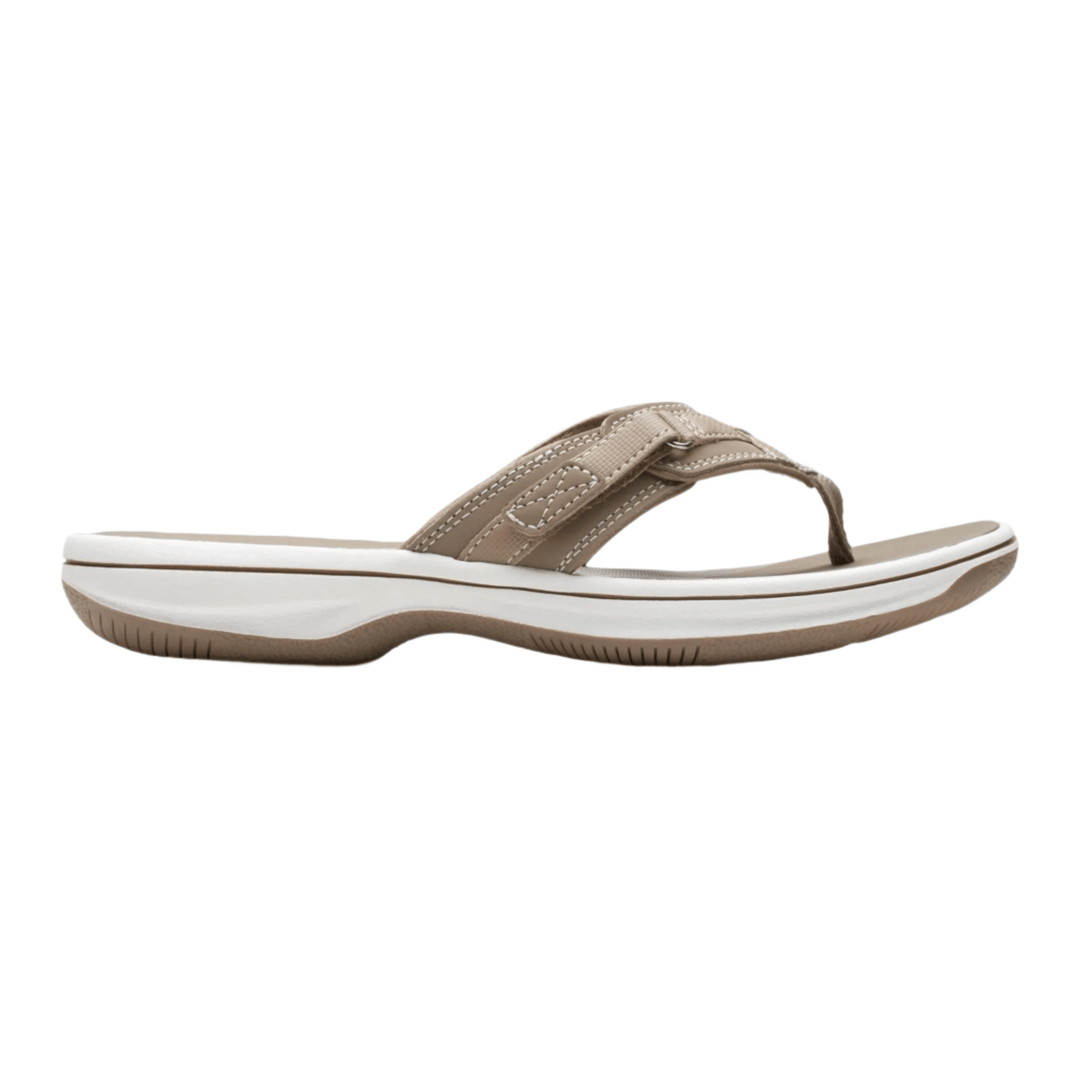 Taupe thong sandal with a white cushioned sole and crisscross strap