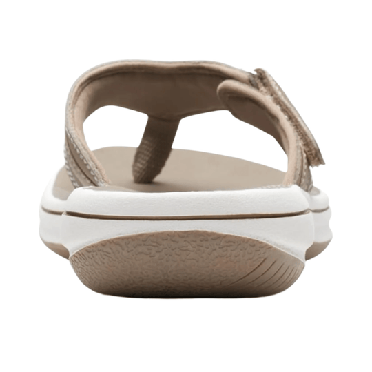 Taupe slip-on sandal with a thick white sole and braided straps