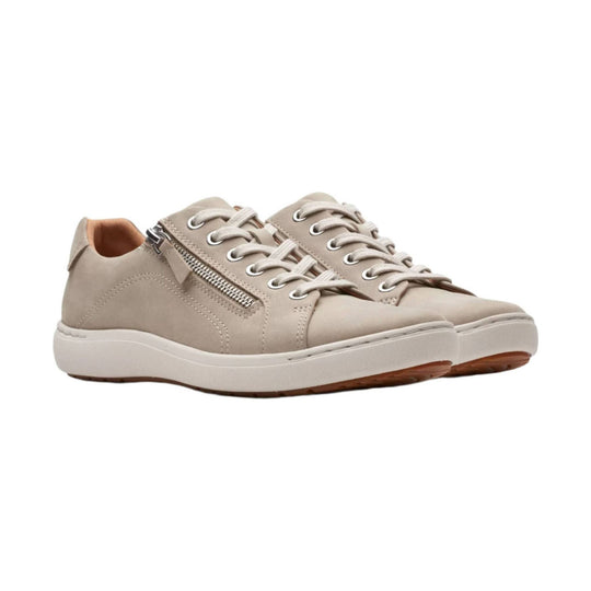 Beige lace-up sneakers with side zippers and white soles