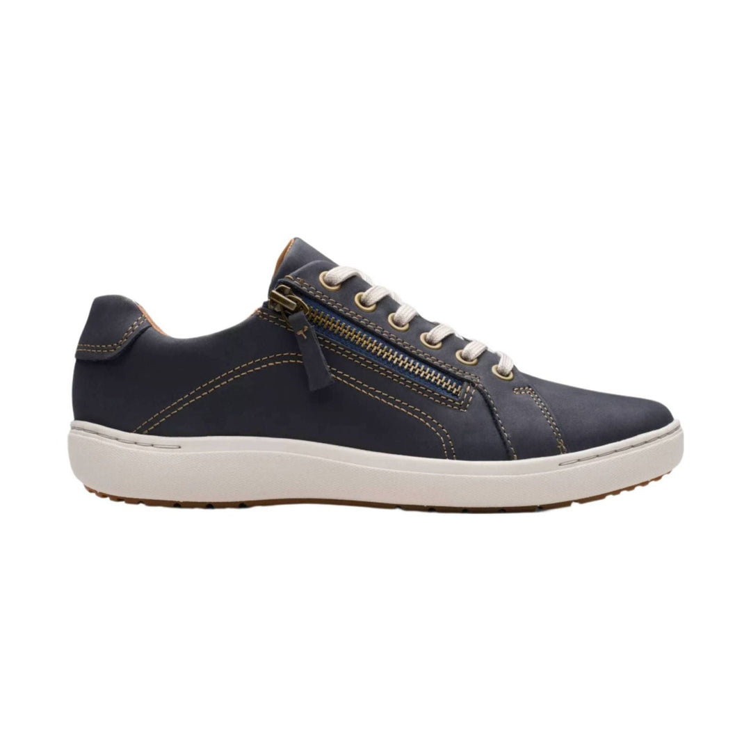 Navy lace-up sneaker with side zipper, white sole, and contrast stitching