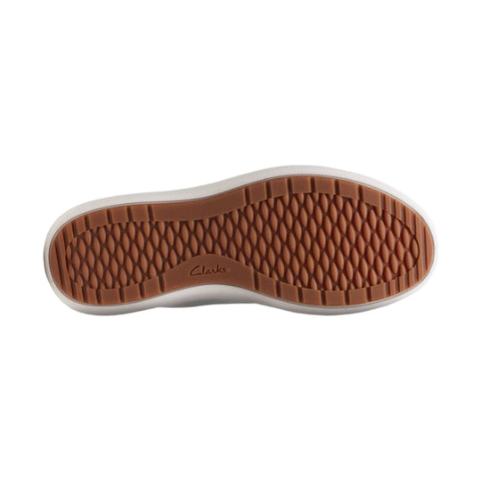 Shoe outsole with brown waffle tread and Clarks logo