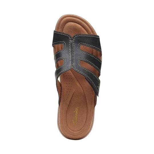 Black strappy open-toe sandal with tan footbed and stitched detailing, top view