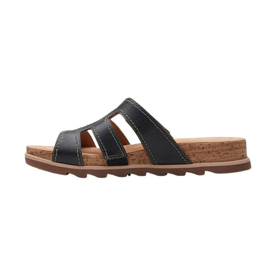 Black leather slide sandal with stitched cutout straps, cork footbed, and brown rubber sole