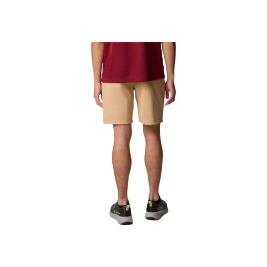 Tan chino shorts on a model, rear view