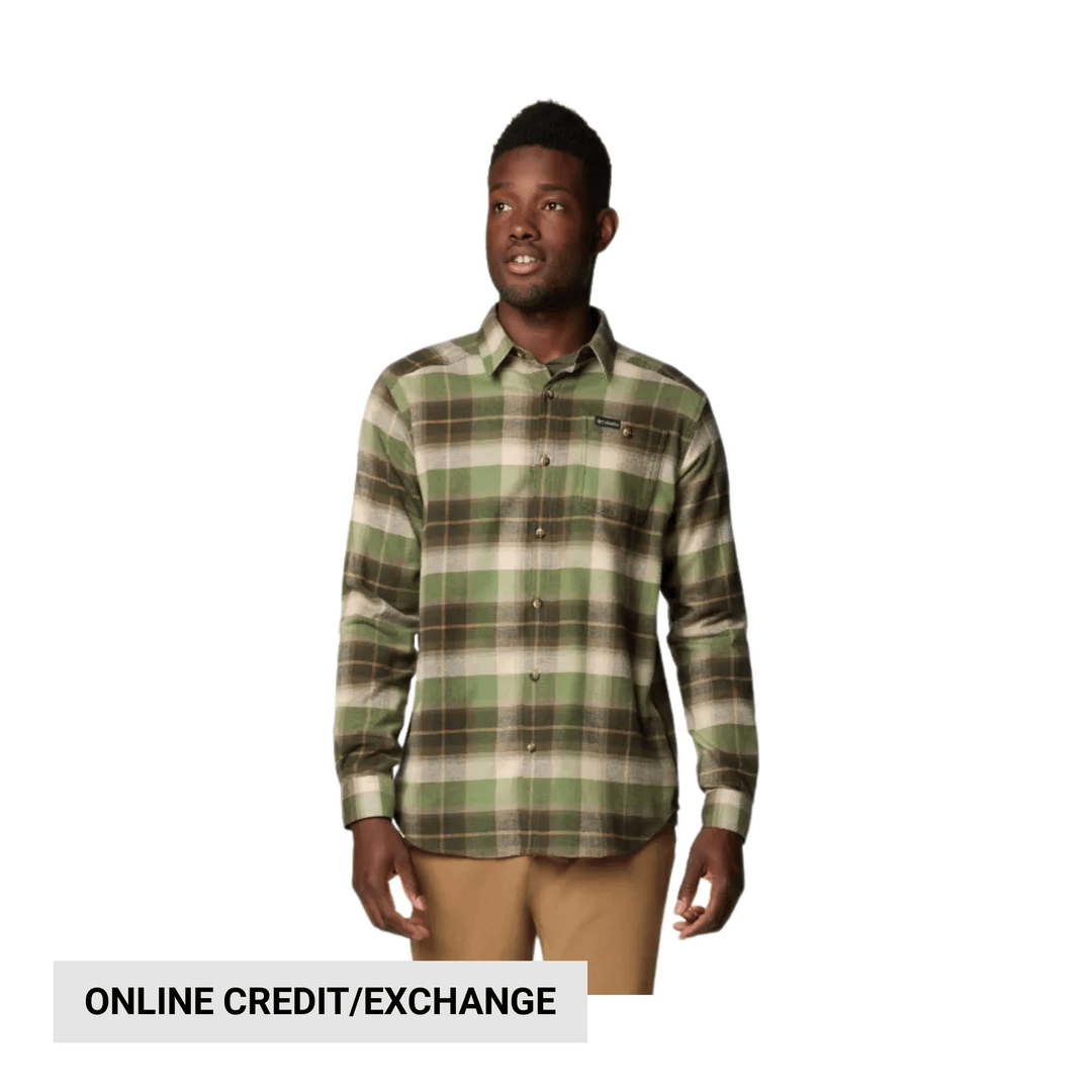 Man wearing a green and brown plaid long-sleeve button-up shirt