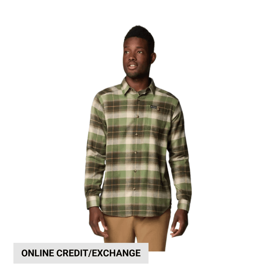 Man wearing a green and brown plaid long-sleeve button-up shirt