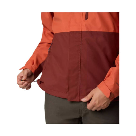 Two-tone orange and burgundy hooded rain jacket with front zipper and adjustable hem