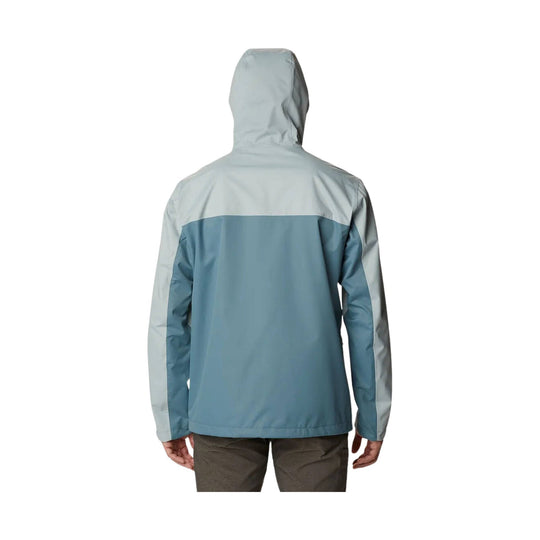 Back view of a two-tone hooded rain jacket in light gray and blue