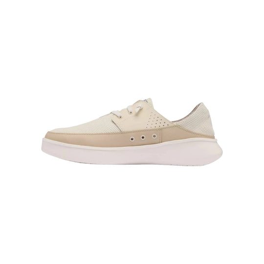 Cream and beige low-top casual sneaker with mesh panels, lace-up closure, and thick white sole
