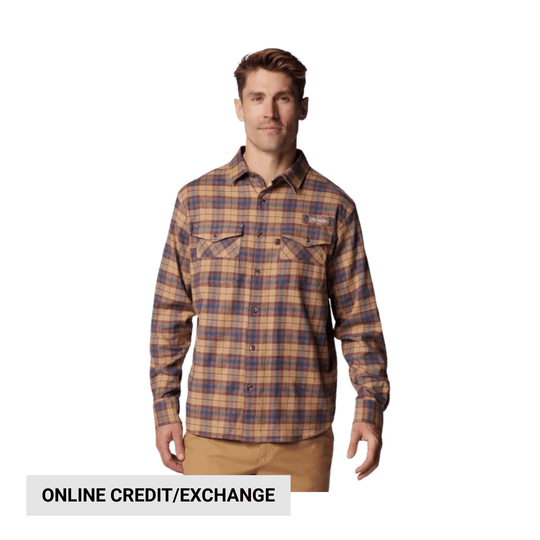Plaid long-sleeve button-up shirt in tan, brown, and blue on a model