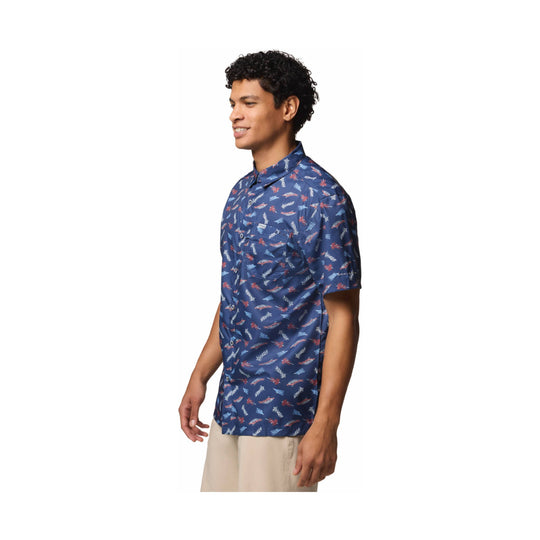 Navy short-sleeve button-up camp shirt with an allover fish print, shown on a model in profile