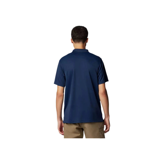 Navy short-sleeve polo shirt shown from the back on a model