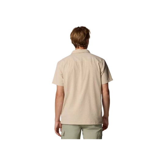 Beige short-sleeve button-up shirt shown from the back