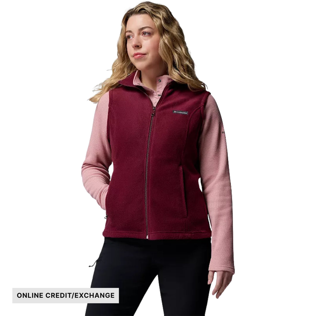Burgundy fleece vest over a light pink long-sleeve shirt with online credit/exchange label