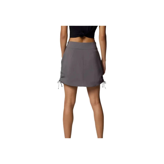 Gray ruched athletic skort shown from the back on a model