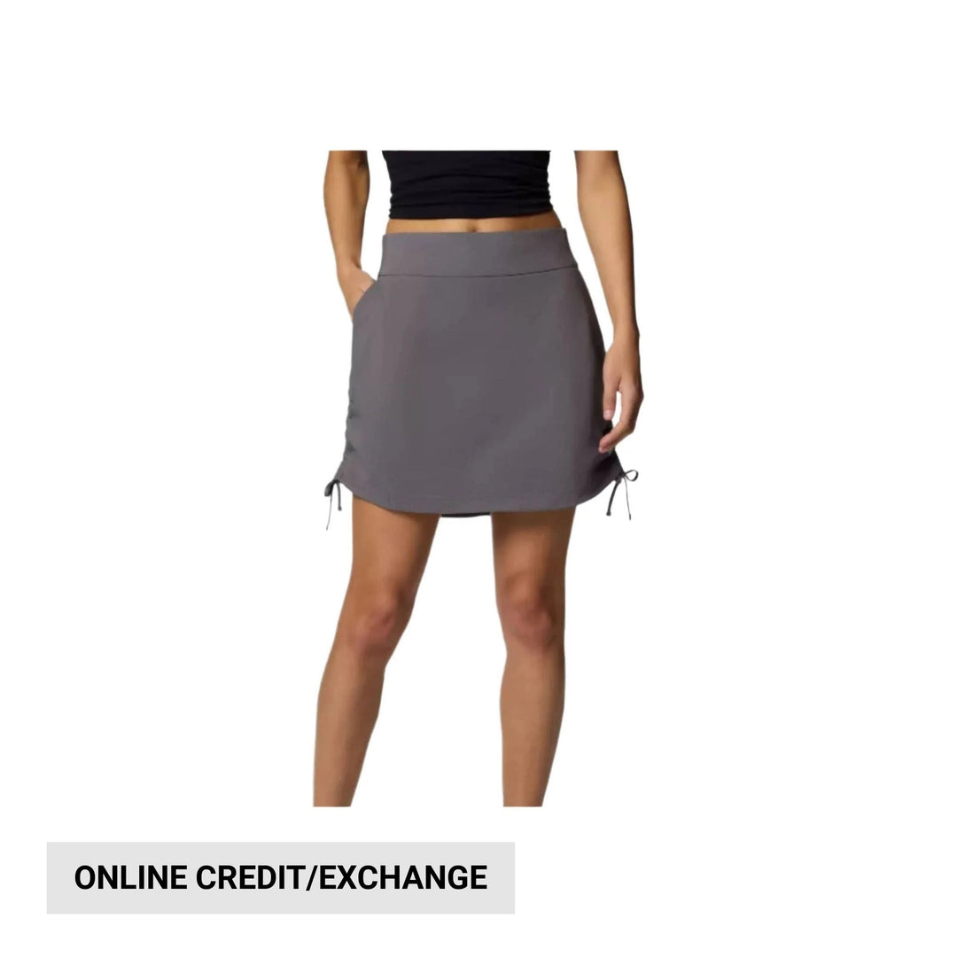 Gray athletic skort with drawstring side ties, worn with a black crop top