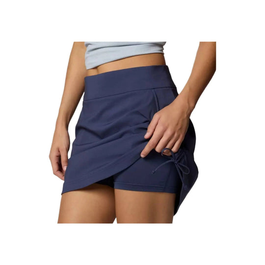 Navy ruched athletic skort with side tie detail over built-in shorts