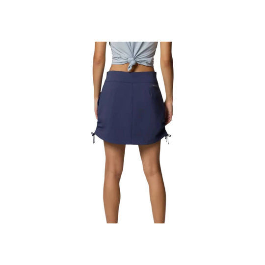 Navy ruched athletic skort with side drawcords, shown from the back
