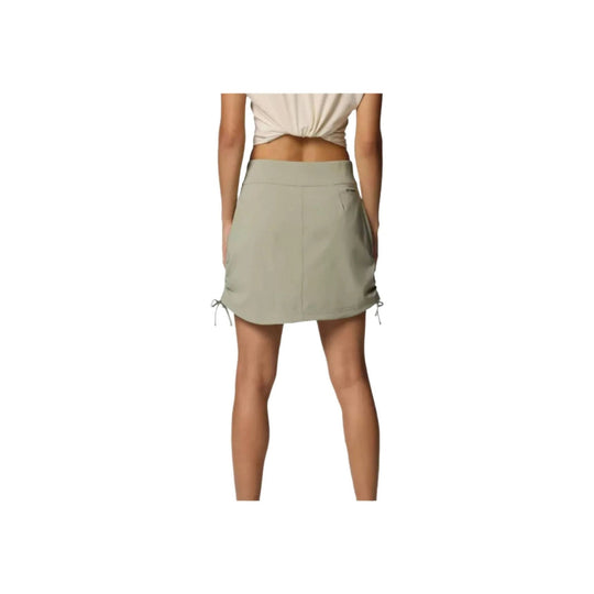 Light sage ruched skort shown from the back with side tie details and a wide waistband