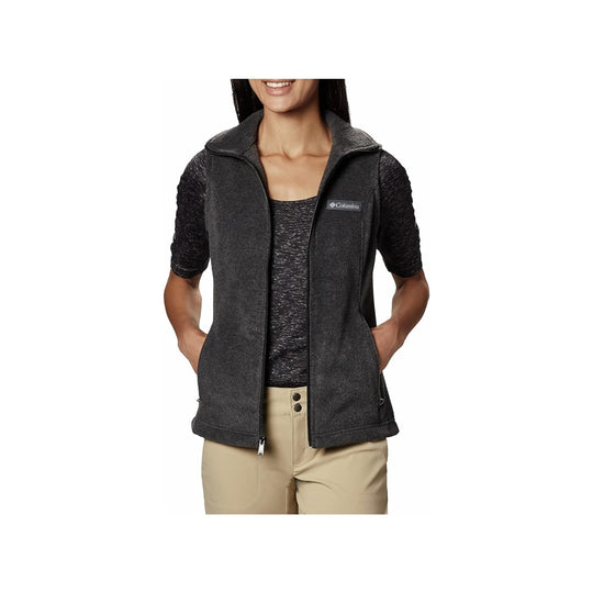 Dark gray fleece vest worn over a black top with hands in pockets and a Columbia logo on the chest