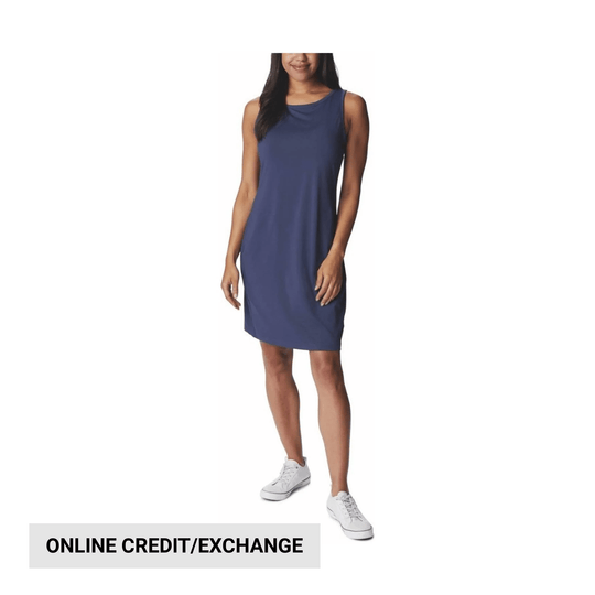 Sleeveless navy dress on a model with white sneakers