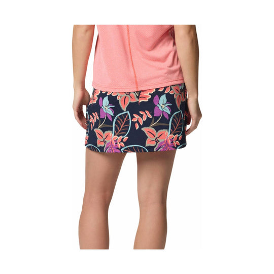Floral-print athletic skort in navy with coral, pink, purple, and teal pattern, shown from the back