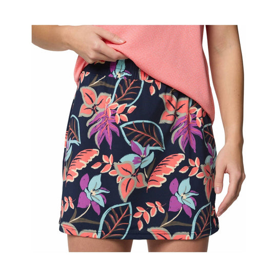 Floral print skort with a navy background and bright pink, purple, and teal leaf pattern