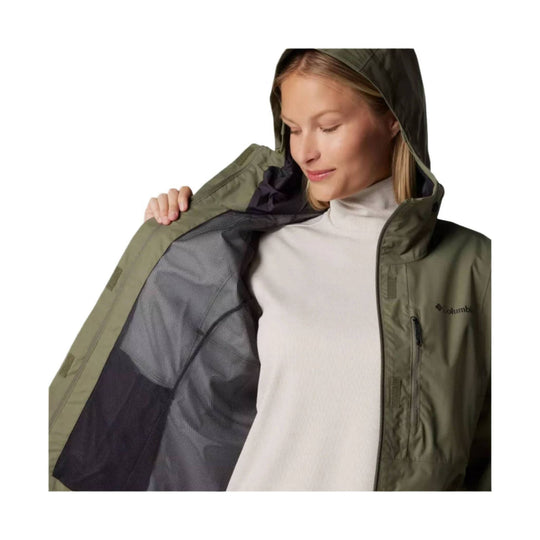 Olive hooded rain jacket shown open over a cream turtleneck