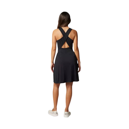 Black sleeveless knee-length dress with crisscross back straps, shown from the back