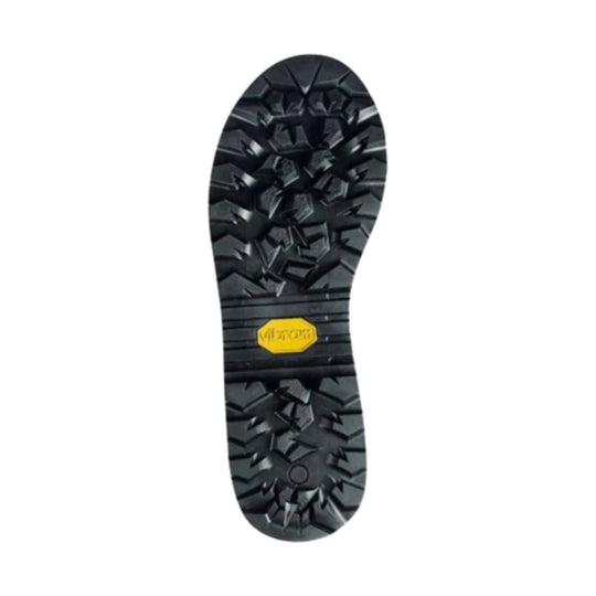 Black boot outsole with deep lug tread and a yellow Vibram logo