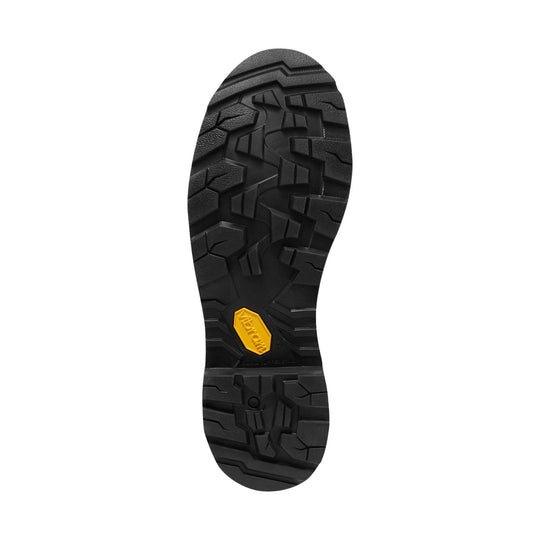 Black lugged boot outsole with a yellow Vibram badge