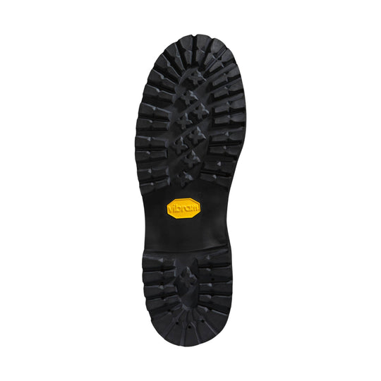 Black lugged boot sole with a yellow Vibram logo