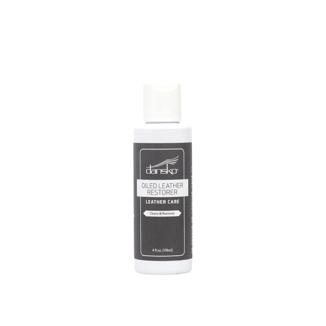 White bottle of leather care with a black label and white cap