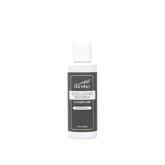 White bottle of leather care with a black label and white cap