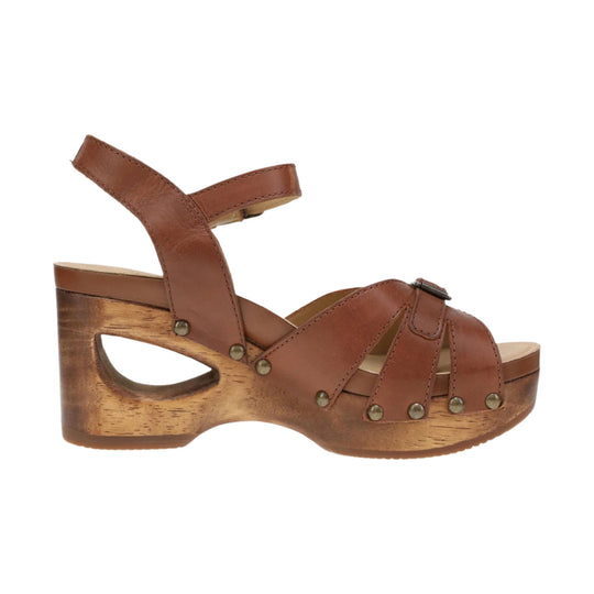 Brown leather wedge sandal with cutout heel, wide ankle strap, and buckle details