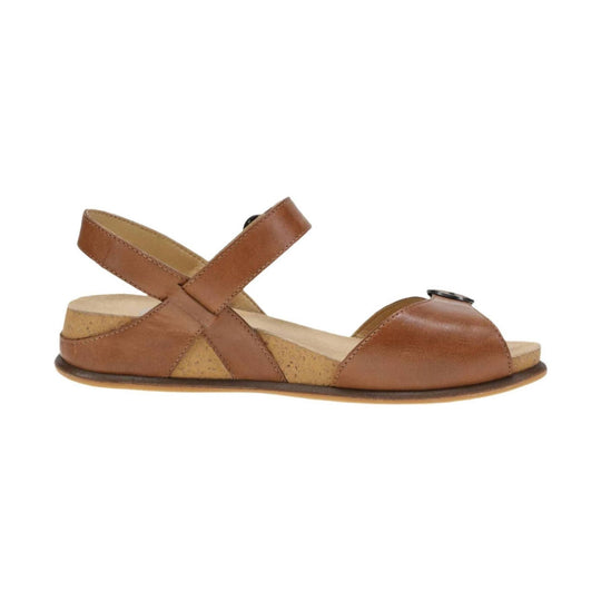 Tan leather sandal with cross ankle straps, cork side panels, and a low platform sole