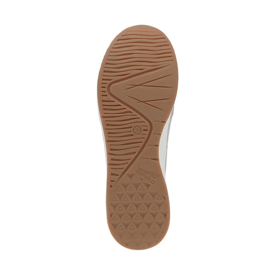 Tan shoe outsole with wavy tread, zigzag grooves, and triangular traction pattern