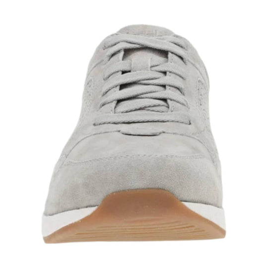 Light gray suede sneaker with laces and tan rubber sole, front view