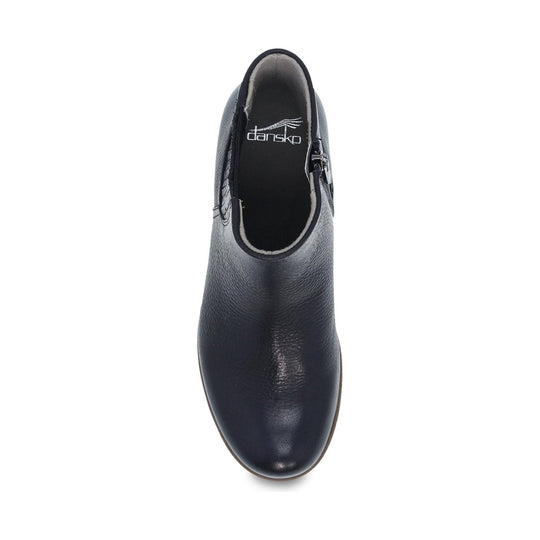 Black ankle boot with side zipper and visible Dansko logo on the insole, top view
