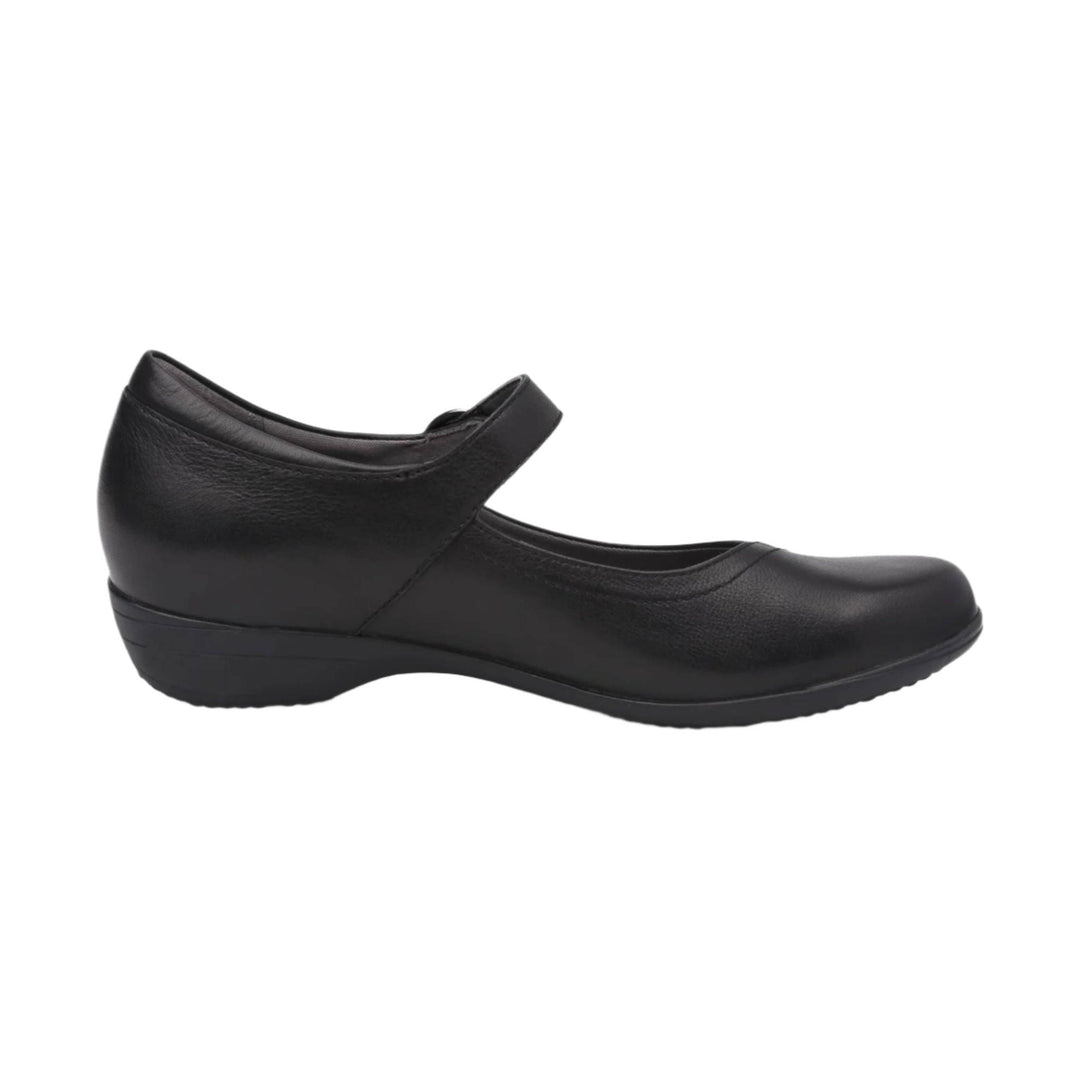 Black leather Mary Jane flat with a rounded toe and wedge heel, side view