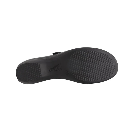 Black shoe outsole with textured tread and Dansko logo