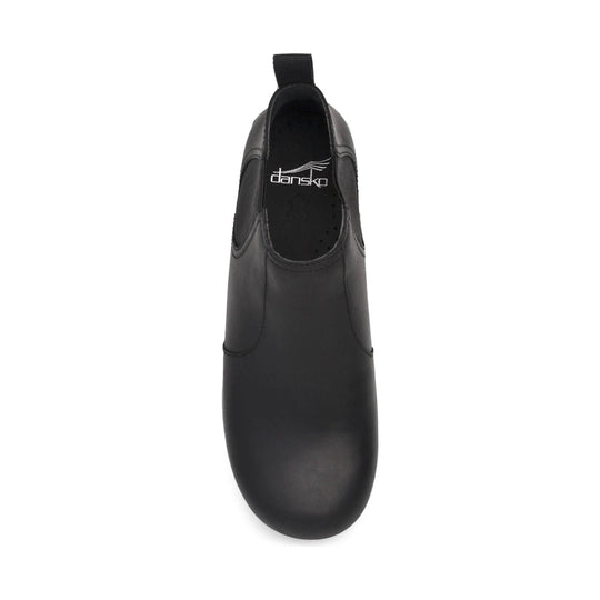 Black slip-on ankle boot with elastic side panels and visible Dansko logo inside