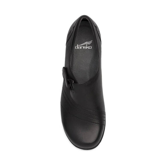 Black closed-toe leather clog with a low heel and visible dansko logo on the insole