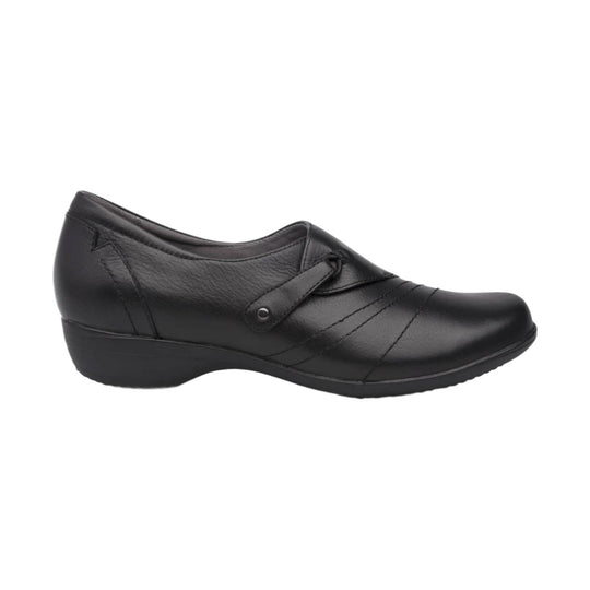 Black leather wedge slip-on shoe with a decorative strap and rounded toe