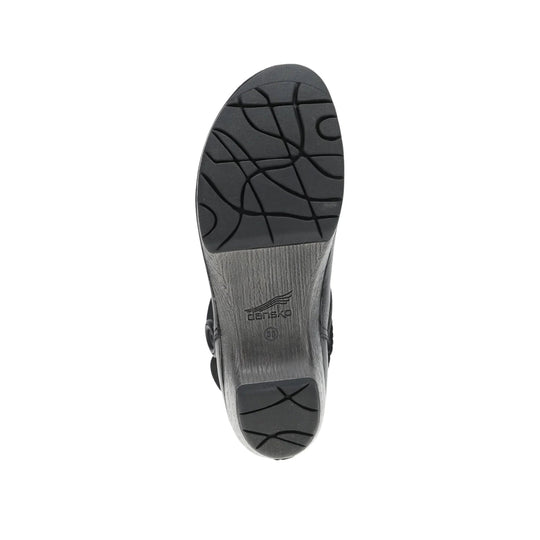 Black boot sole with textured tread and Dansko logo