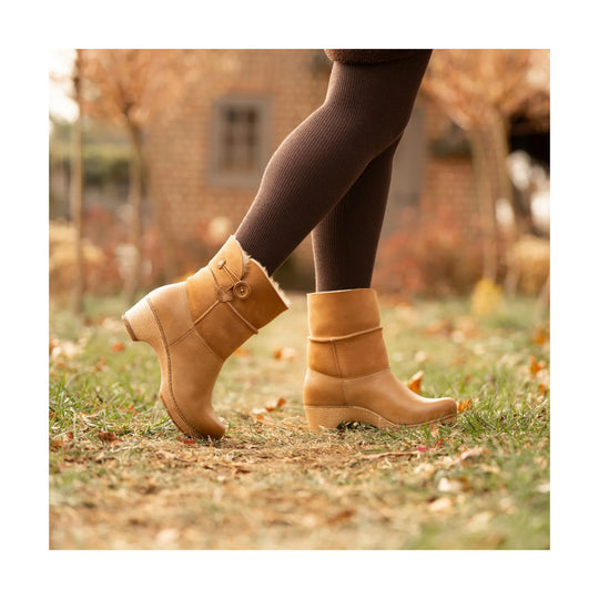 Tan suede ankle boots with wedge heels and side button detail