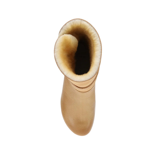 Tan shearling-lined boot shaft with rounded toe and suede upper