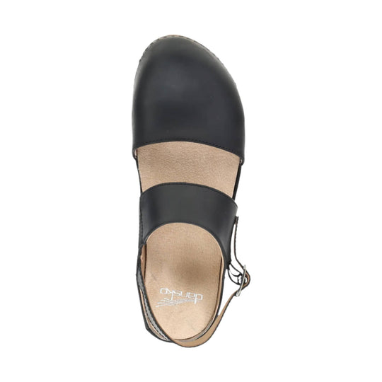 Black closed-toe slingback sandal with a tan footbed and ankle strap