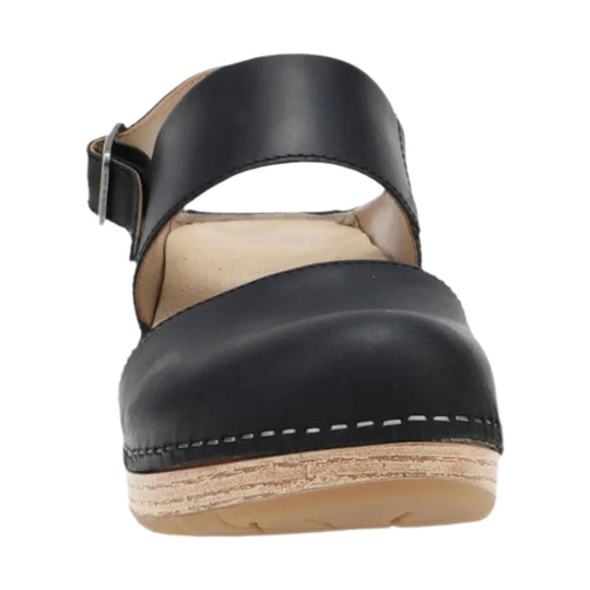 Black leather sandal with a wide ankle strap, open toe, and cork-look wedge sole