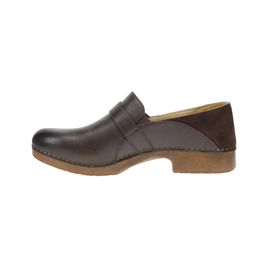 Brown leather clog with a closed toe, ankle strap, and wood-look heel
